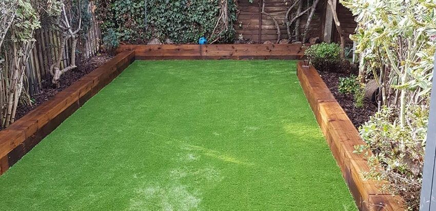 Why do many people use fake grass as a solution to their lawn woes?